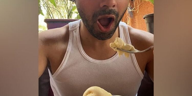 Bollywood actor Varun Dhawan enjoys a scoop of ice-cream for lunch